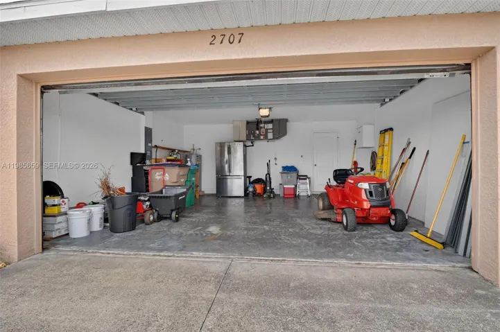 2 car garage (personal items and refrigerator do not convey)