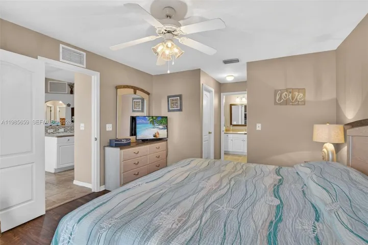 Primary with double walk-in closets and ensuite bathroom