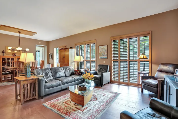 Three sliding glass doors in living area