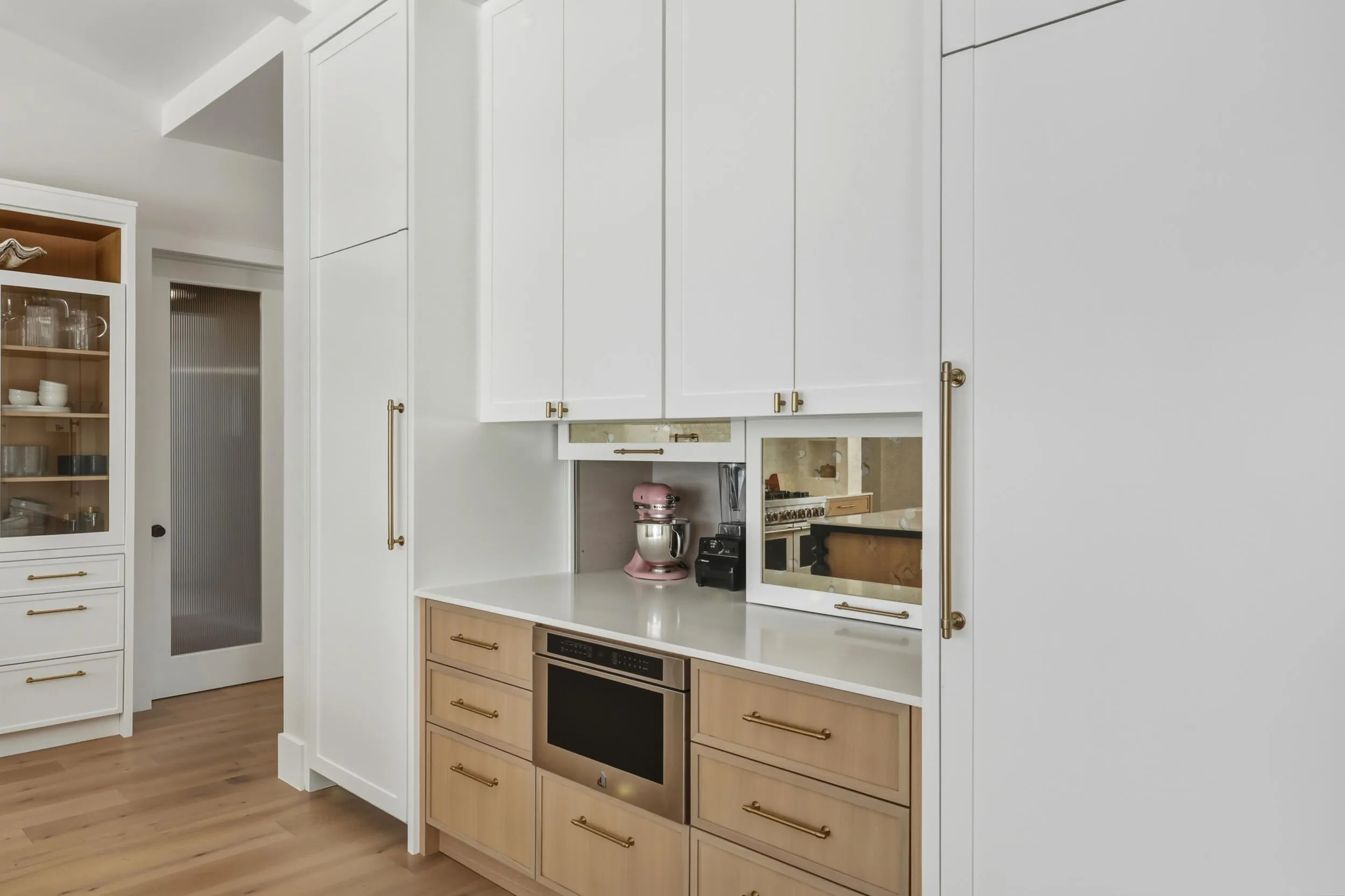 Separate full size paneled fridge & freezer tower with cabinetry going to ceiling for extra strorage