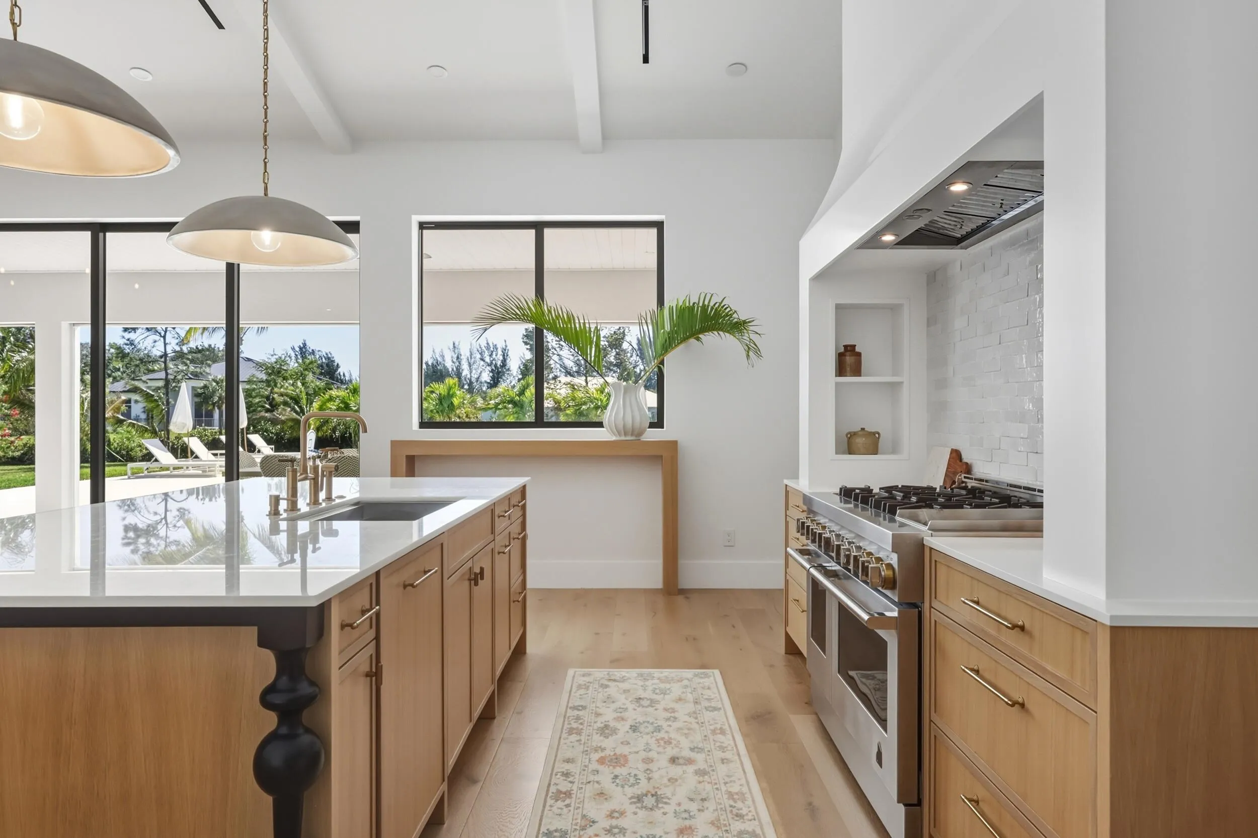 Rift cut white oak bottom cabinets with integrated trash and dishwasher