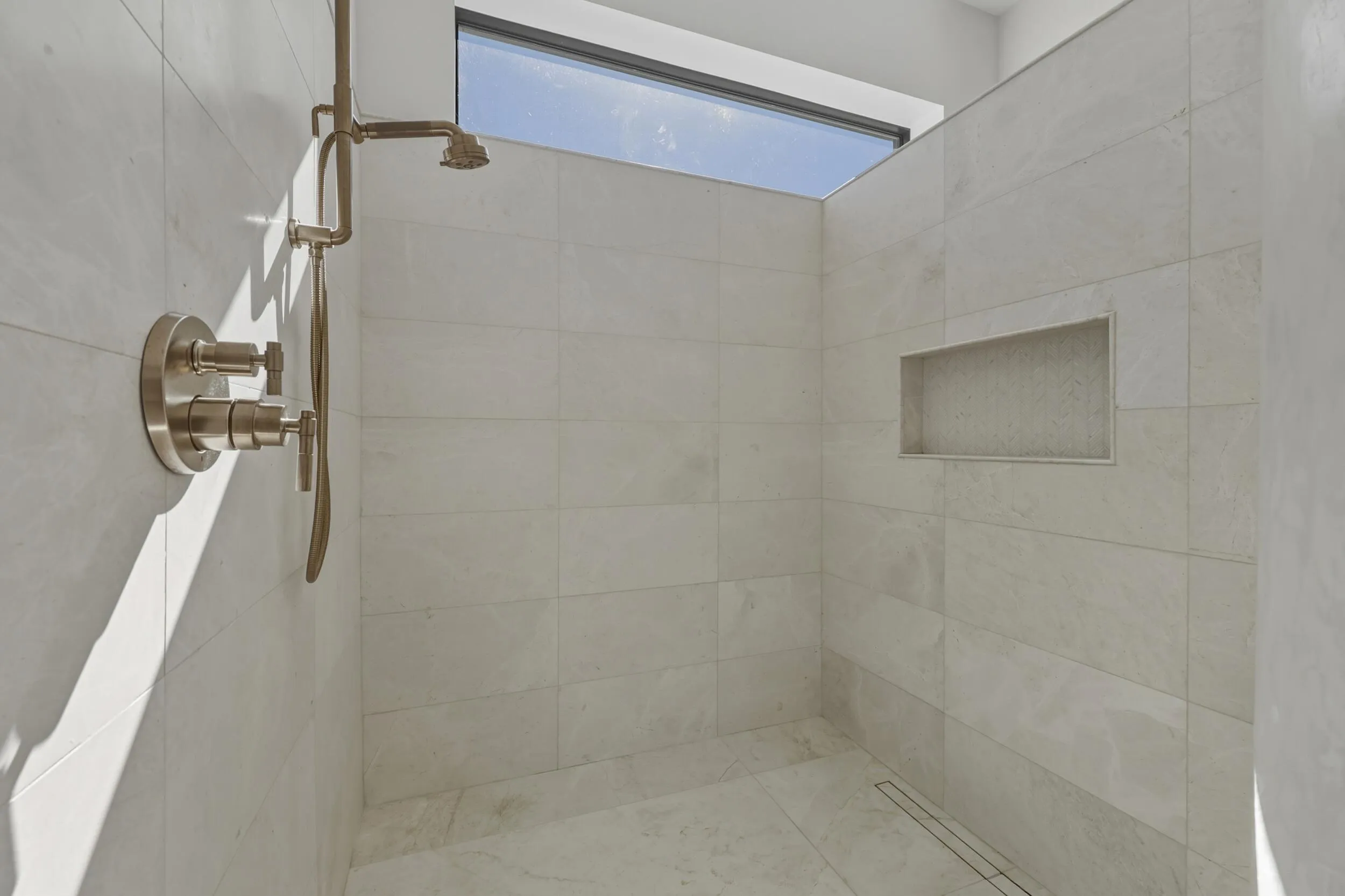 Stunning walk in shower with window detail & rain shower