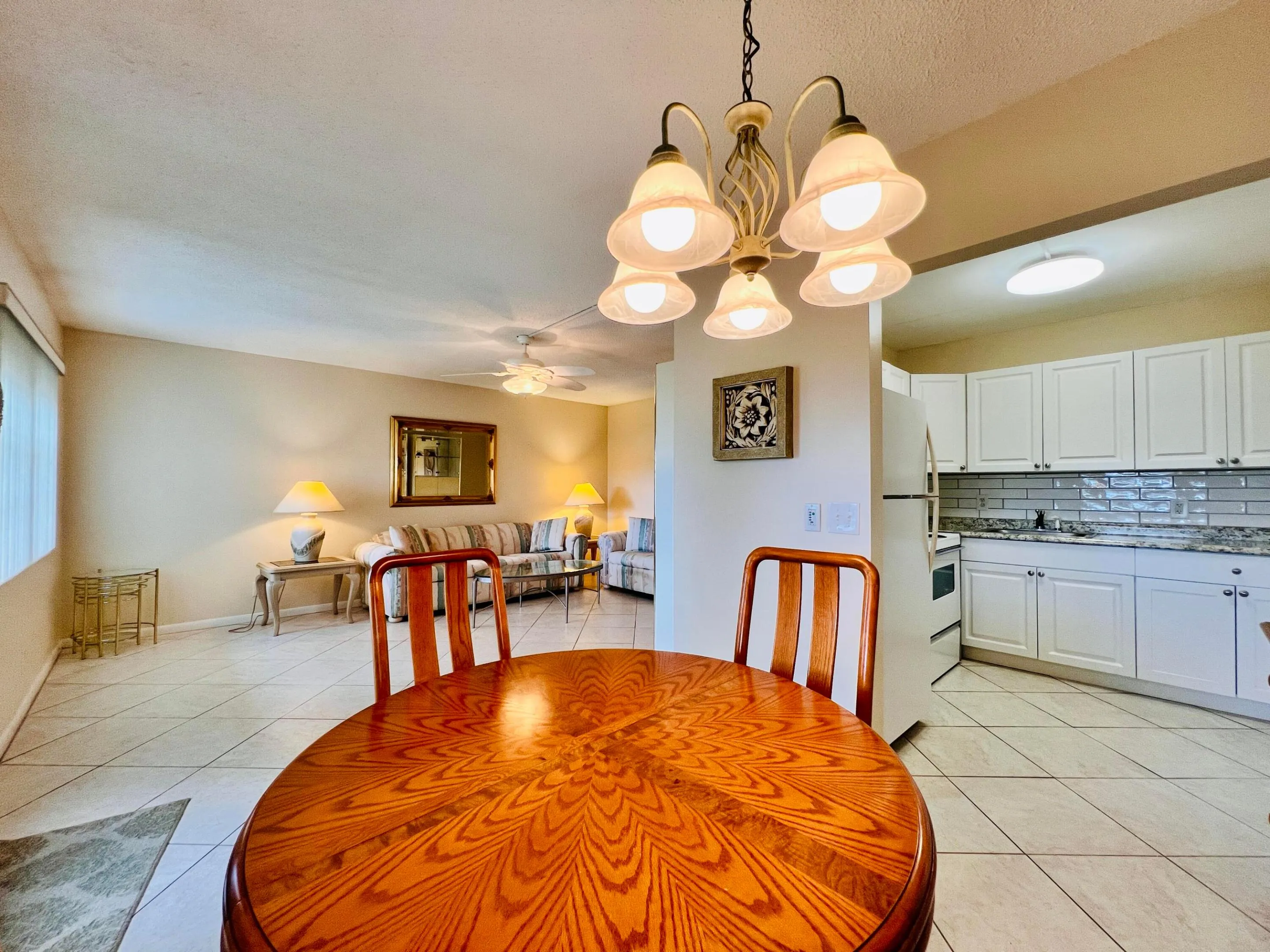 Light & Bright Floor Plan. Neutral Tile Flooring Flows Through Out the Living, Dining, Kitchen, and Bedroom 2