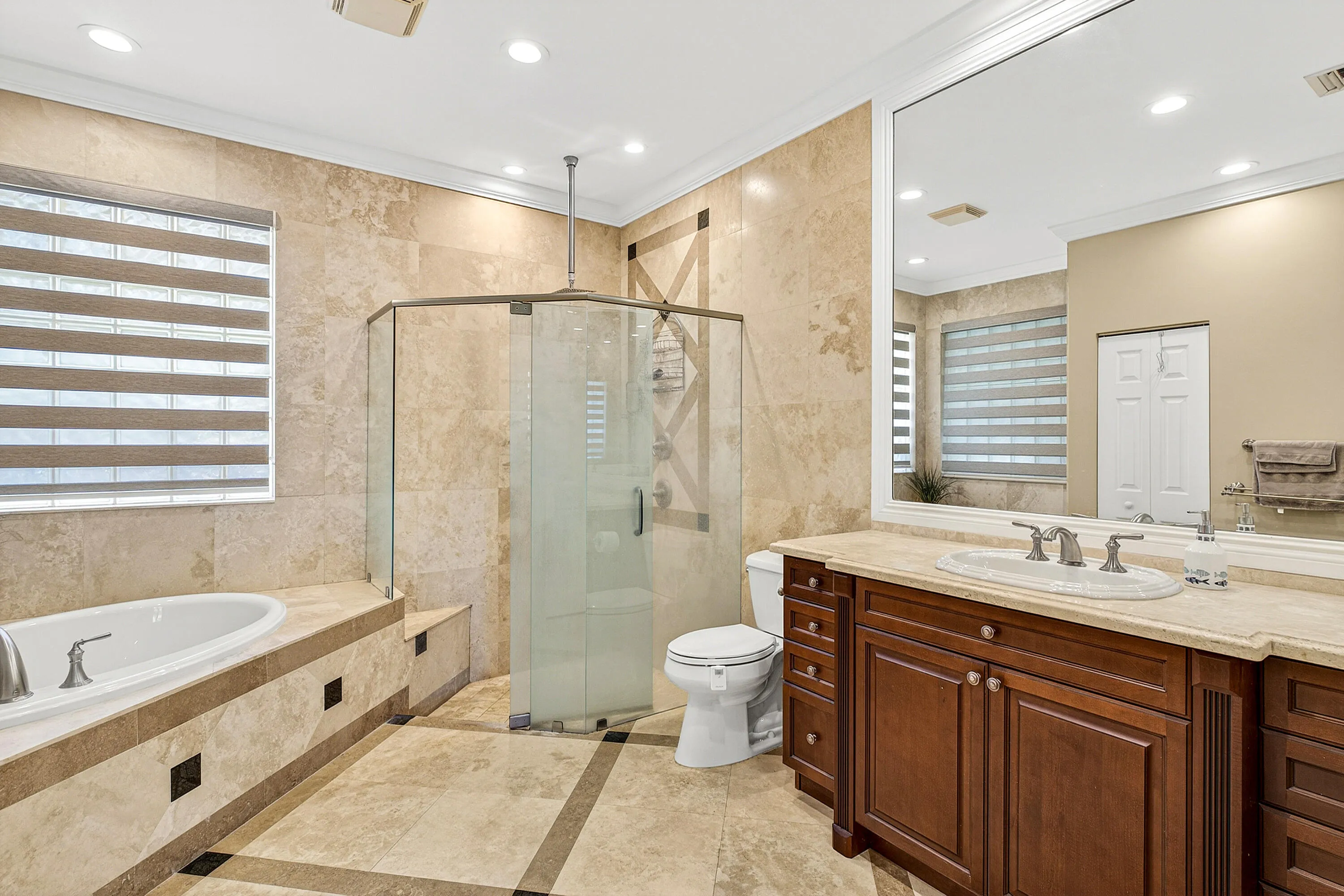 Well-appointed primary bathroom with spacious layout and spa-like atmosphere. Primary bath designed for comfort and convenience within the owner's private suite.