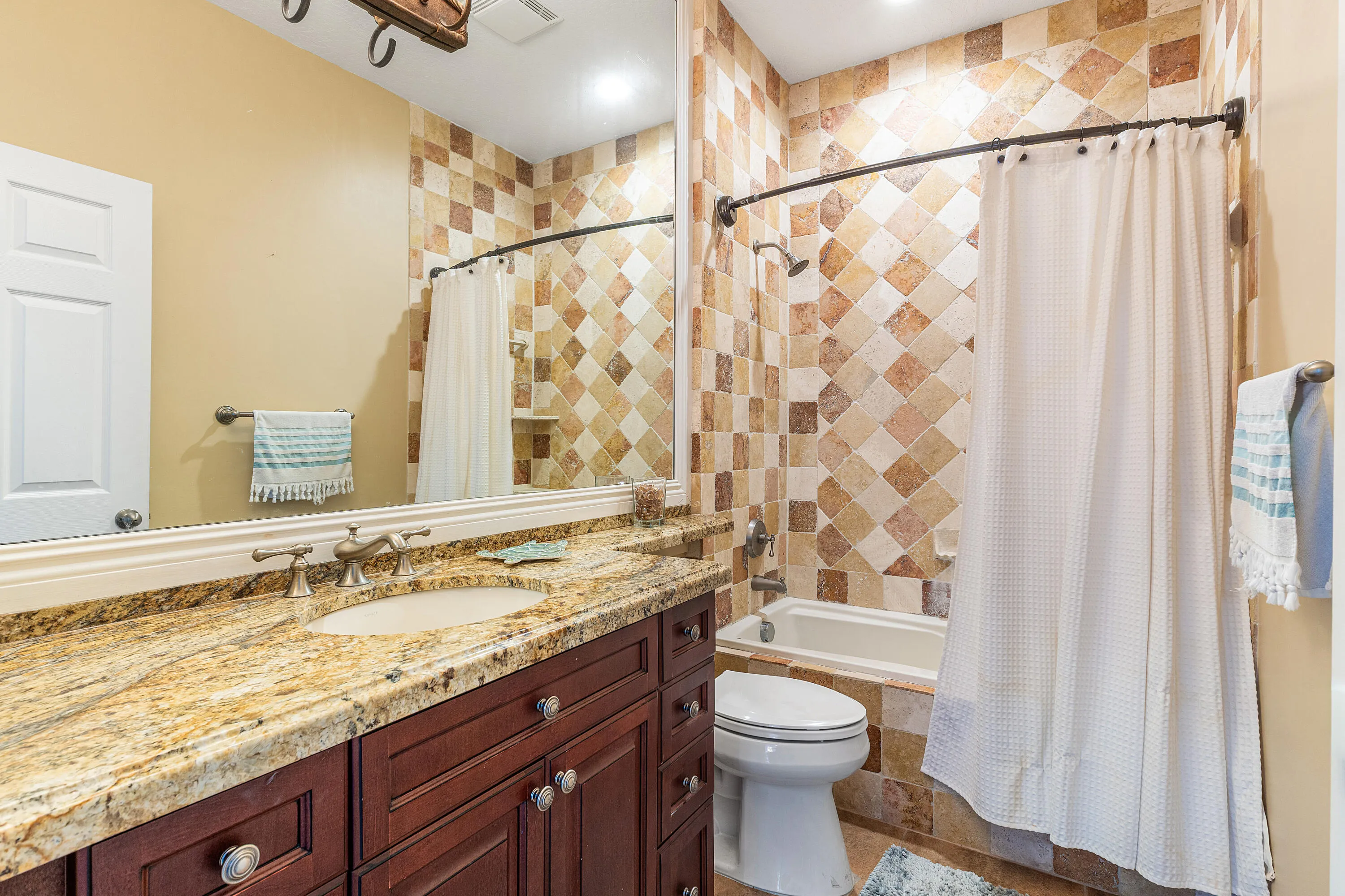 Well-maintained guest bathroom conveniently located near the secondary bedrooms. Clean and functional bathroom serving family members and guests.
