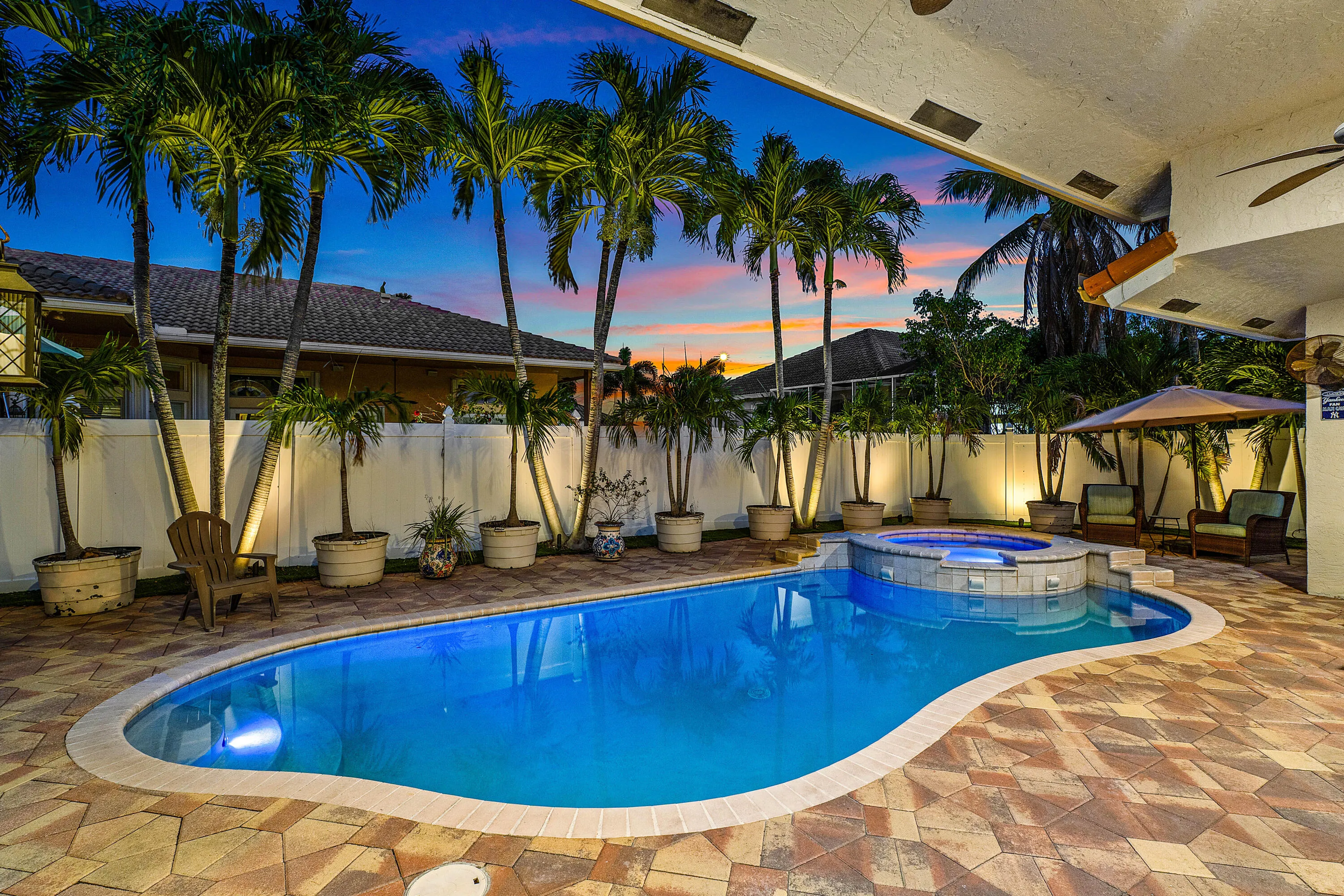 Resort-style pool and spa overlooking the tropical backyard of this luxury Cypress Creek home. Designed for entertaining and enjoying the South Florida lifestyle. Private heated pool and spa surrounded by lush landscaping in this 4 bedroom, 3 bathroom Cypress Creek residence in Boynton Beach.