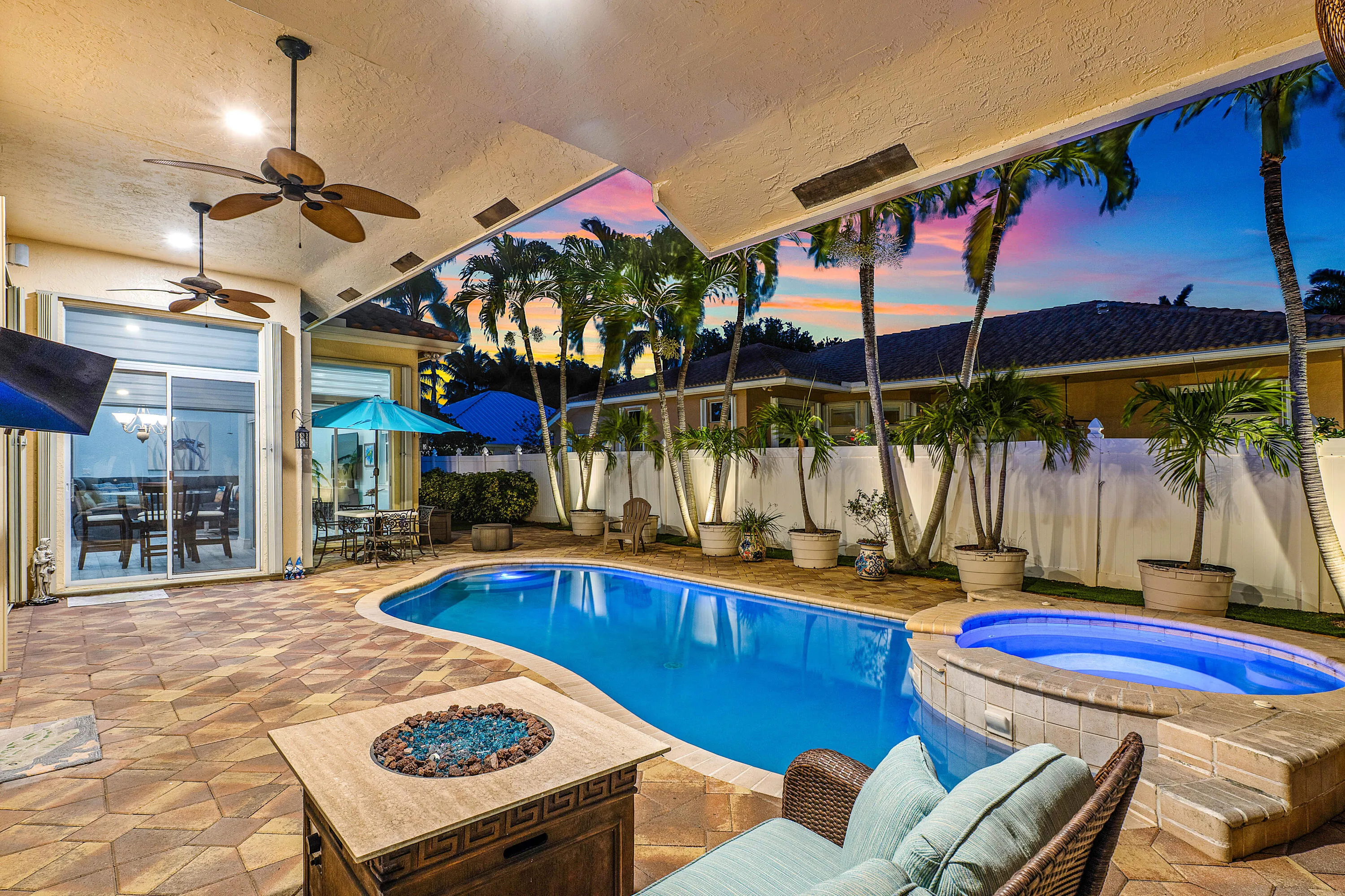 Resort-style pool and spa overlooking the tropical backyard of this luxury Cypress Creek home. Designed for entertaining and enjoying the South Florida lifestyle. Private heated pool and spa surrounded by lush landscaping in this 4 bedroom, 3 bathroom Cypress Creek residence in Boynton Beach.