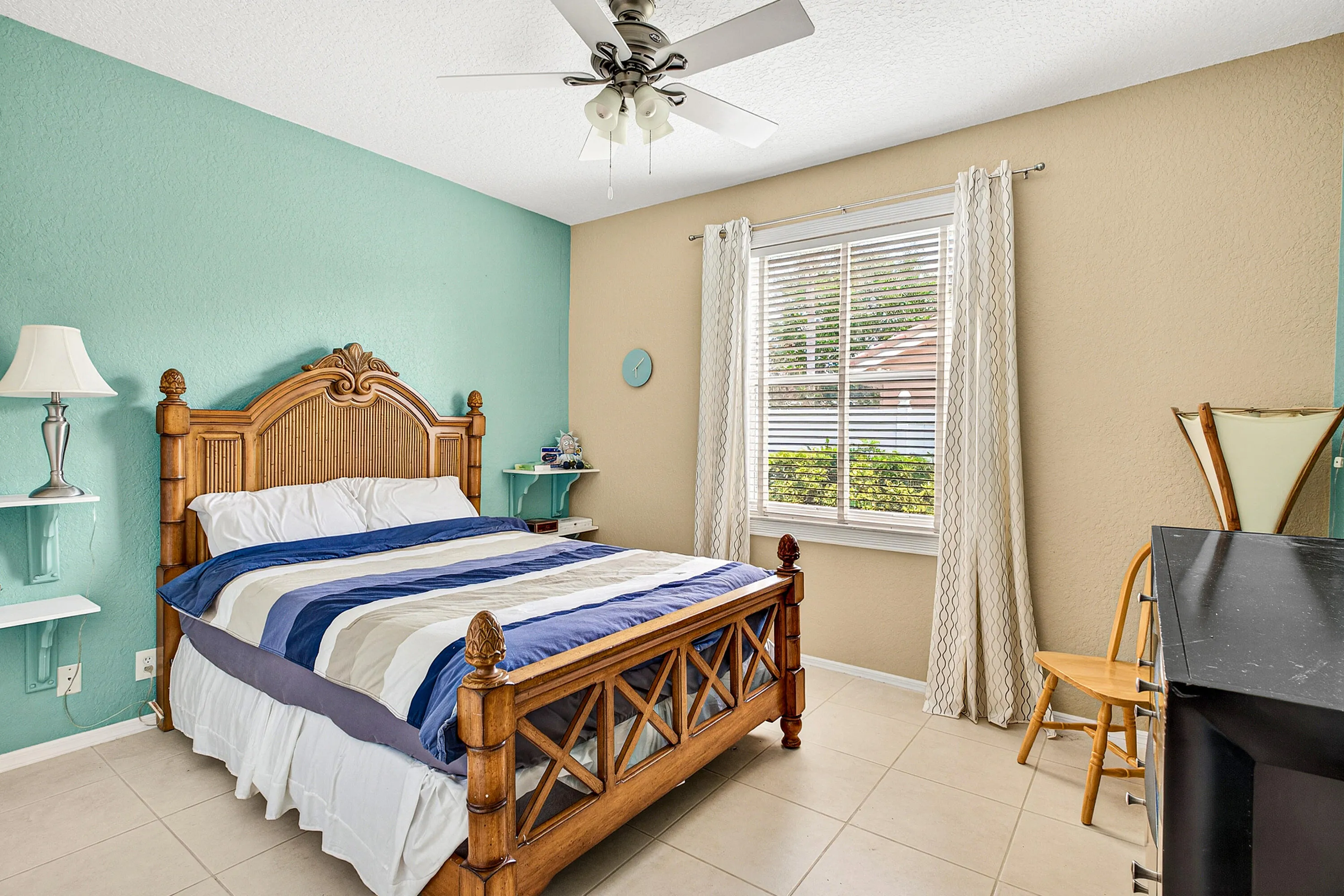 Bright guest bedroom offering flexibility for family, visitors, or a home office. Spacious secondary bedroom with natural light and ample closet space.