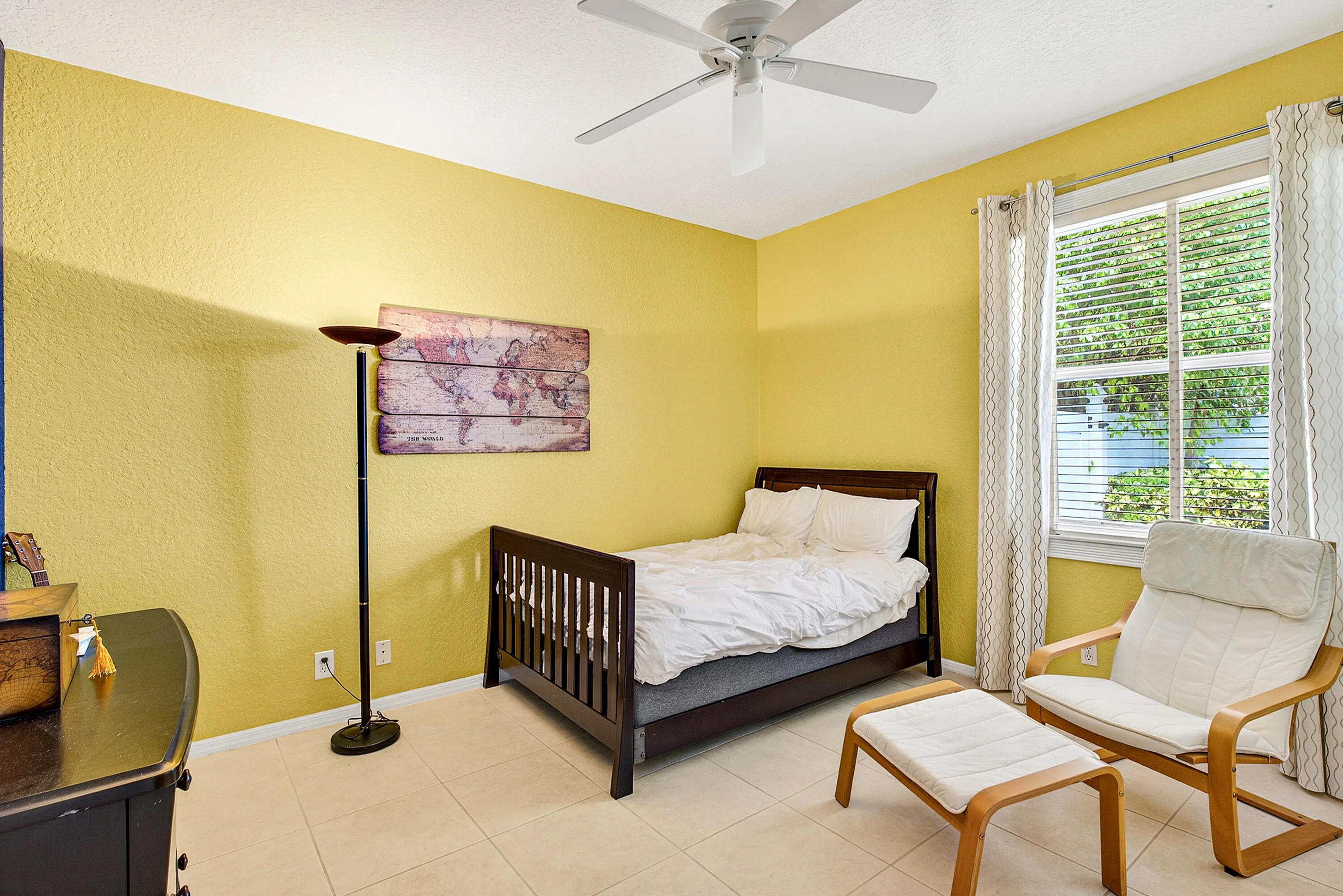 Bright guest bedroom offering flexibility for family, visitors, or a home office. Spacious secondary bedroom with natural light and ample closet space.