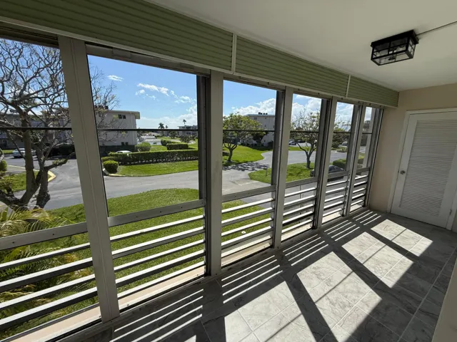 Salacious balcony with roll up shutters and a storage closet