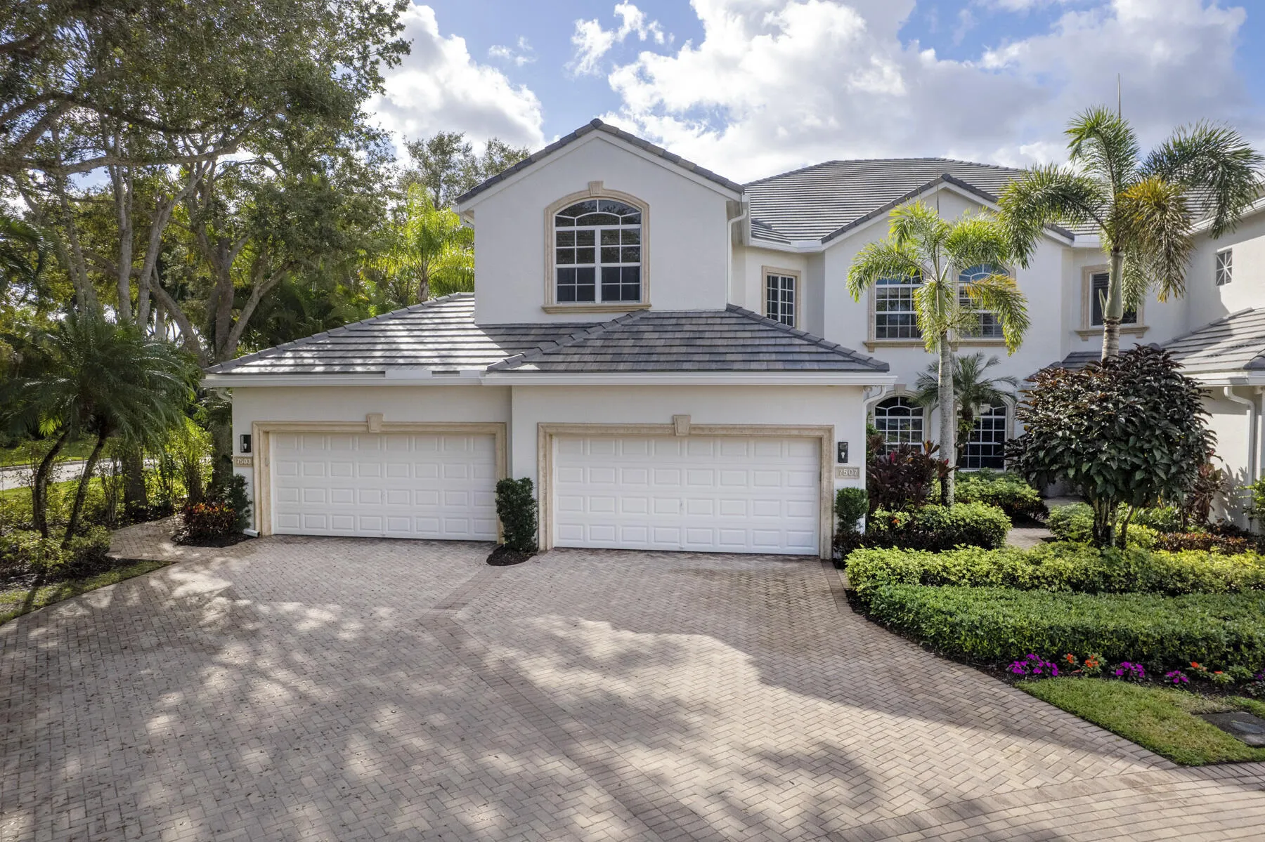 Long driveway-unit's garage is on the right side