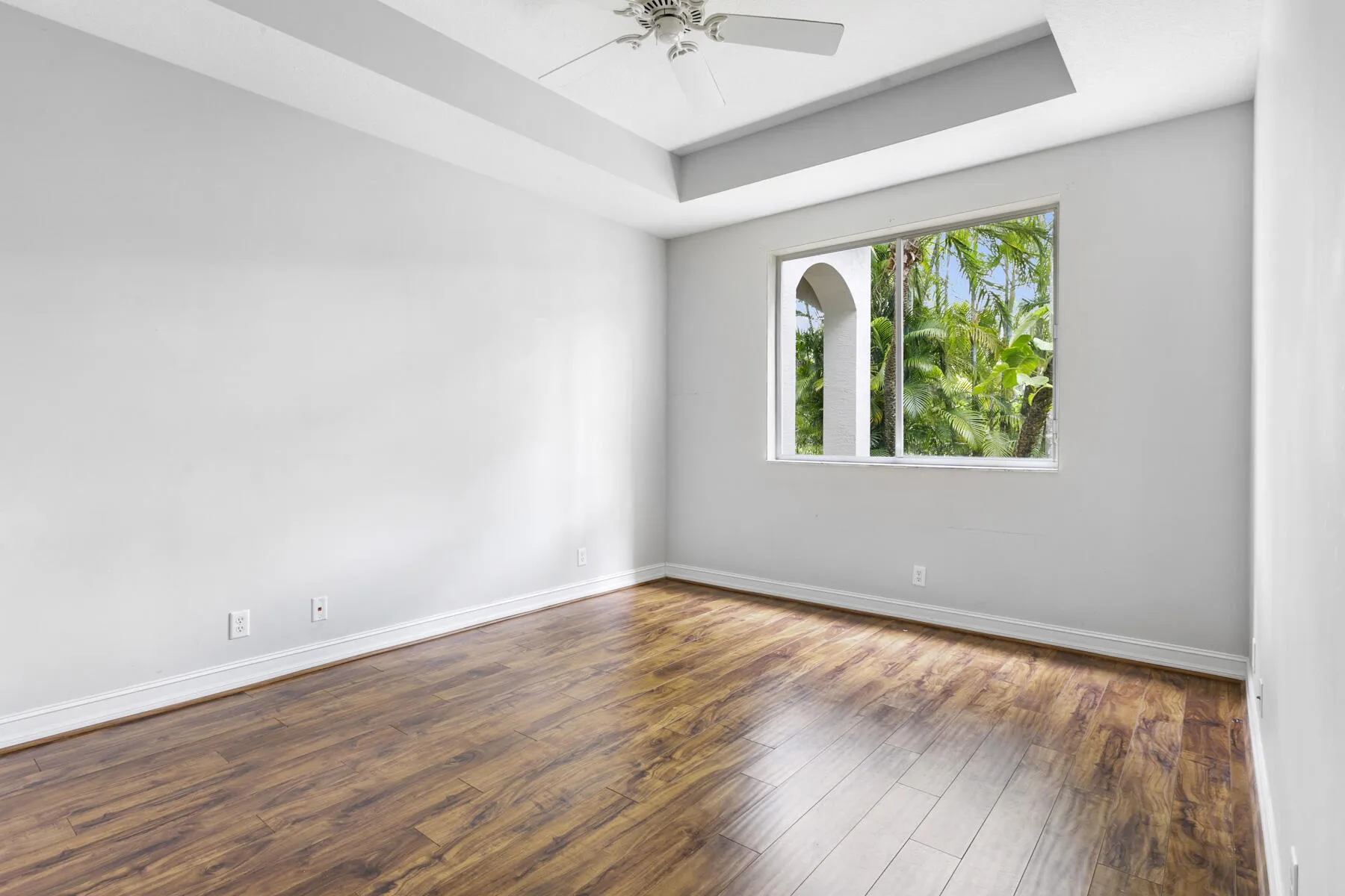 Another guest bedroom with laminate wood flooring