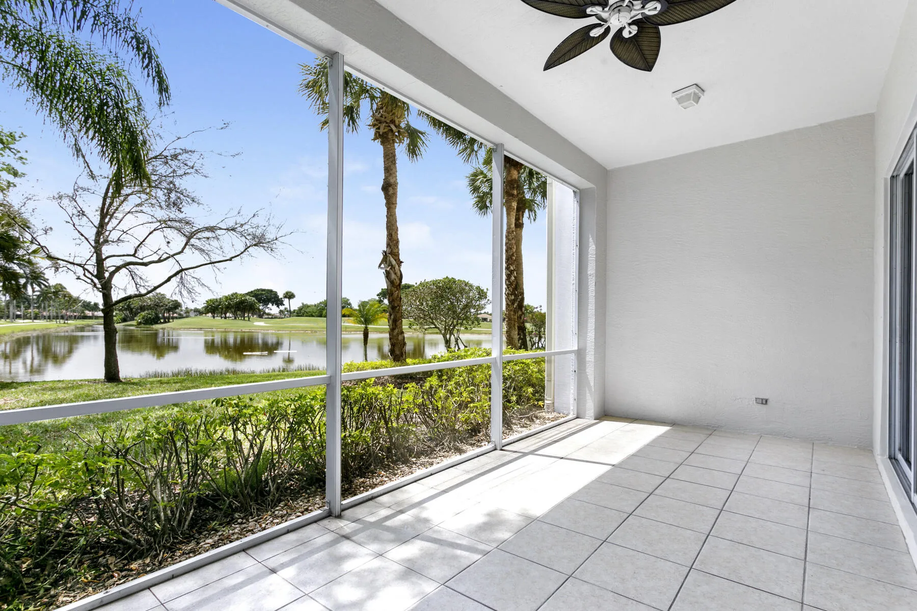 Screened-in porch with lovely water and golf views