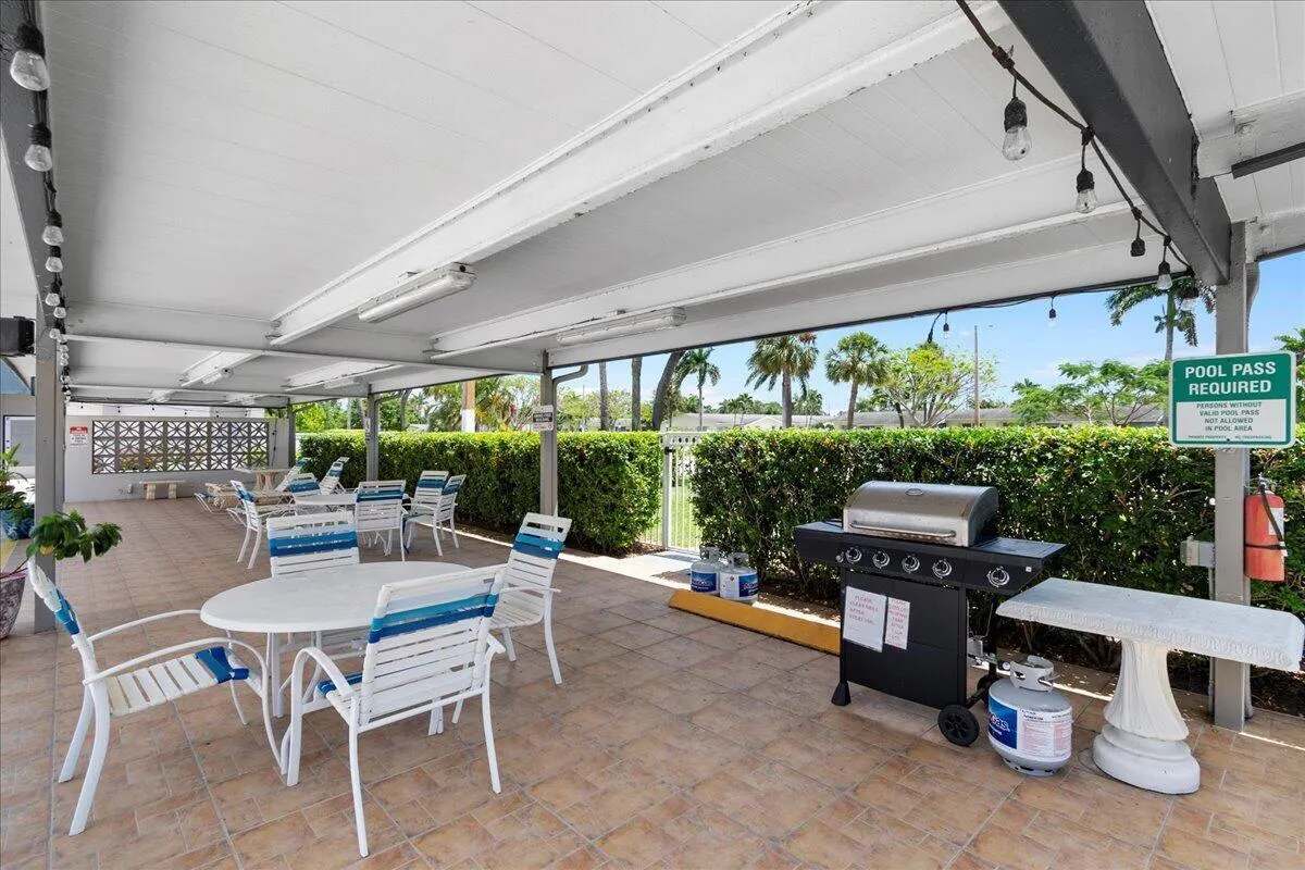 Shaded seating area with grilling space.
