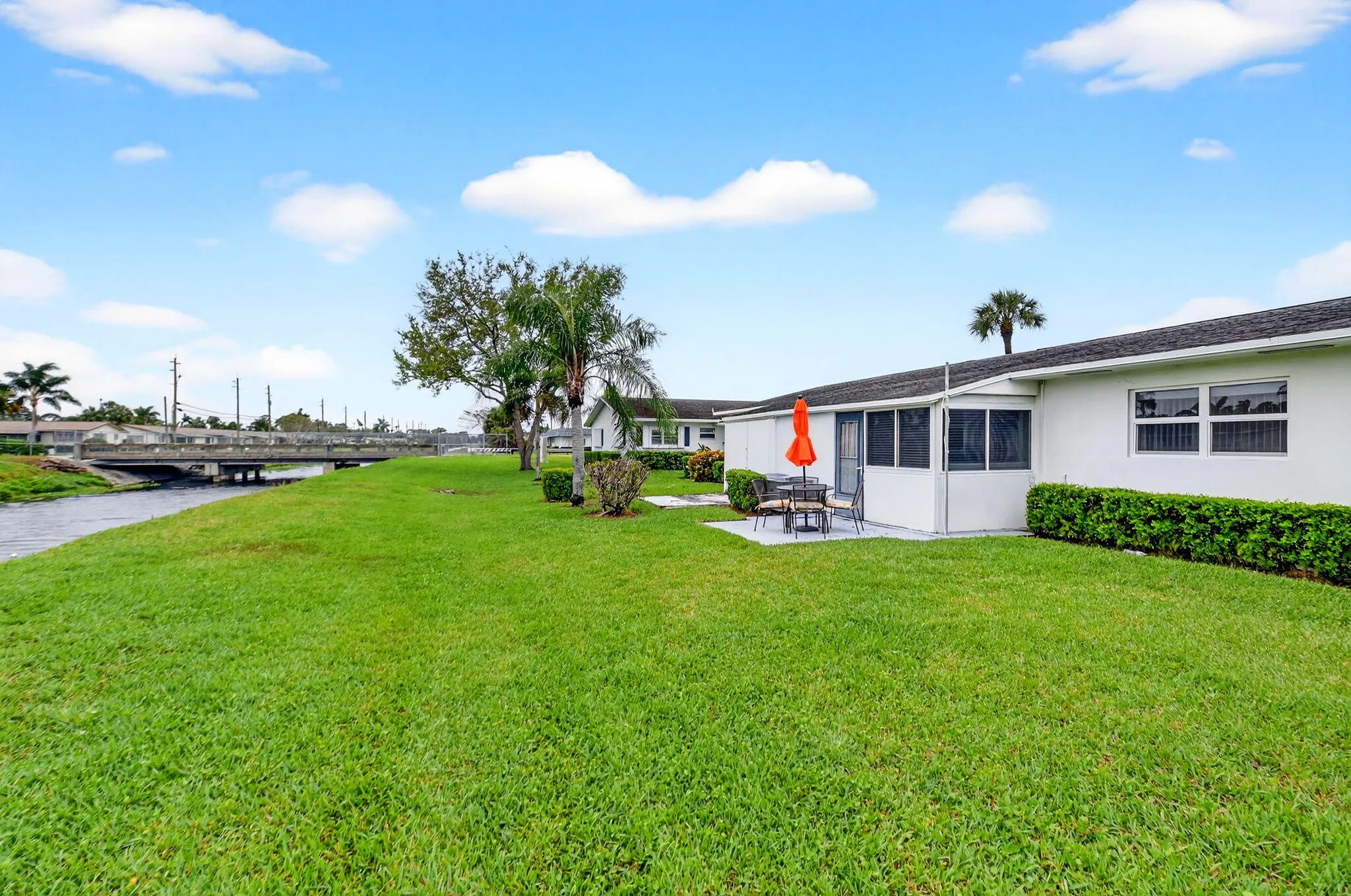 Peaceful setting offering open space & tranquil water backdrop.
