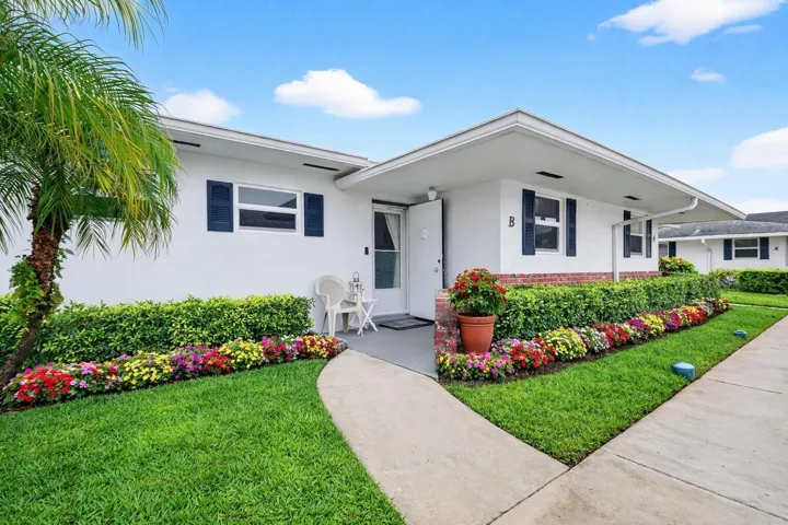 Attractive curb appeal with vibrant surroundings and welcoming charm.