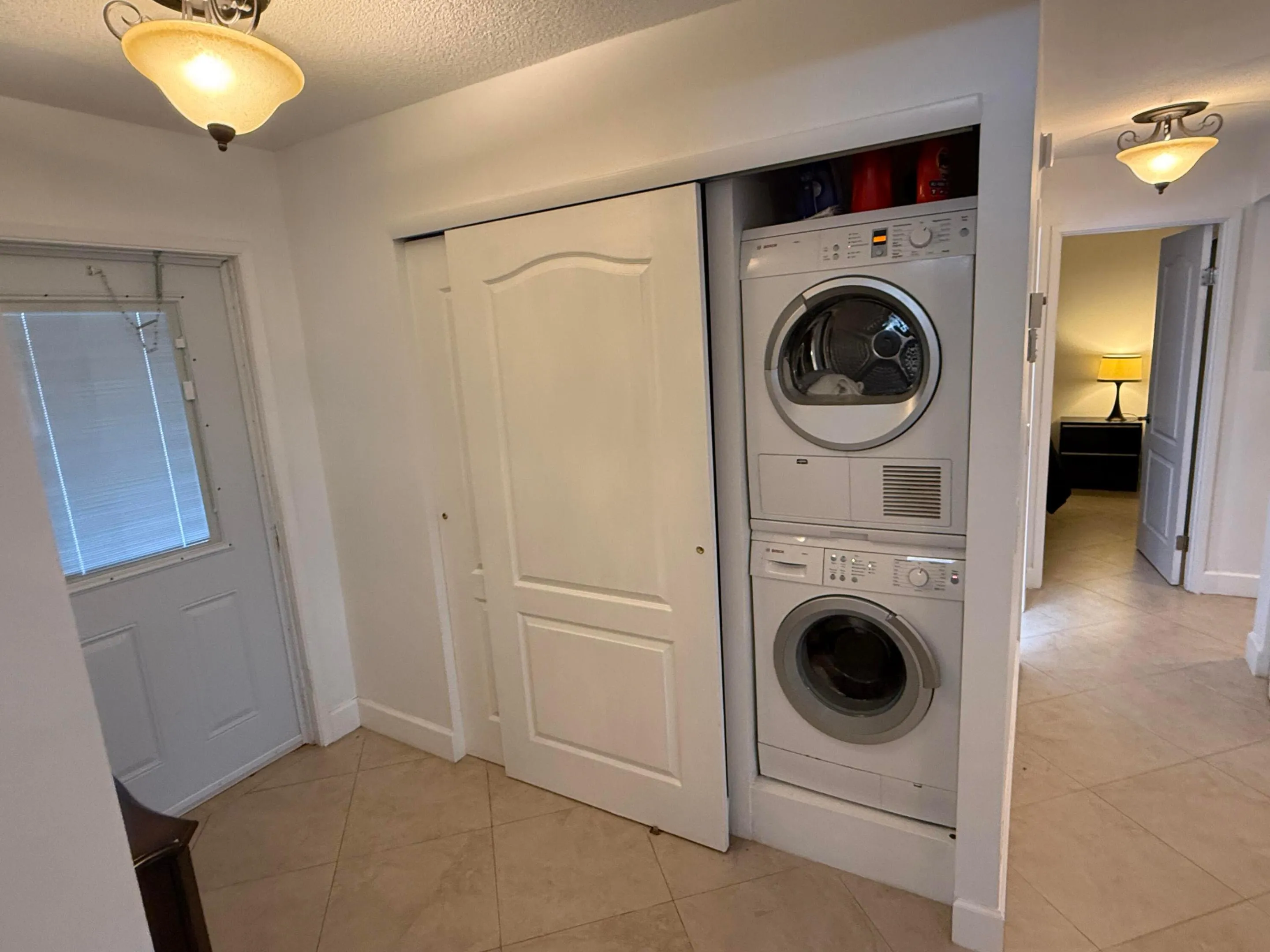 Washer/Dryer on Right in Closet facing Kitchen.