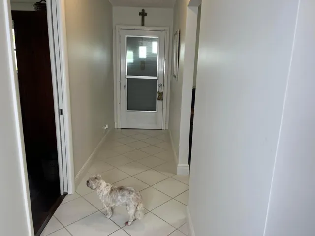 One of the residents awaits your arrival in the foyer