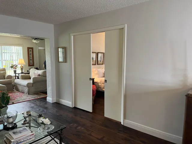Pocket doors enclose the second bedroom suite