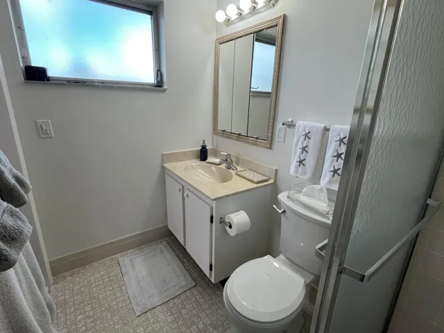 Bath has ceramic tile and a window