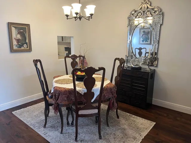 Formal dining room is sited near the pass-through from the kitchen