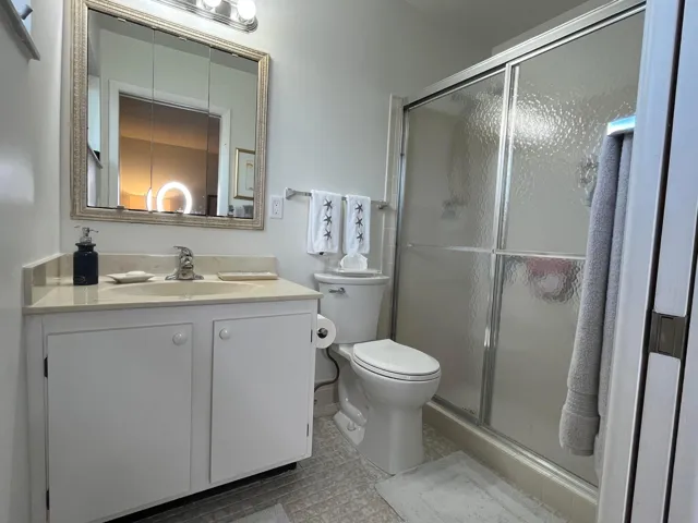 En suite bath has a large shower