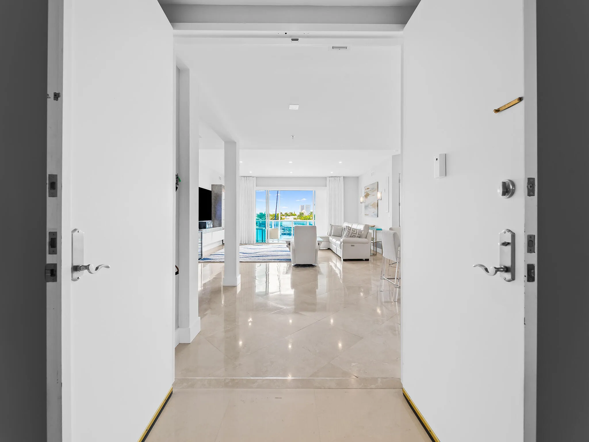 Double door entry opens to a wow factor living room..