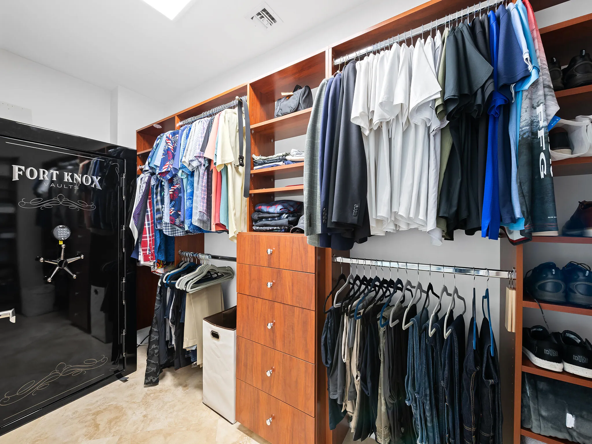 Both his and her closets include a generously sized safe..