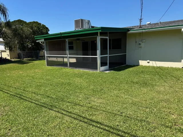 Very spacious porch over looking Beautiful Yard
