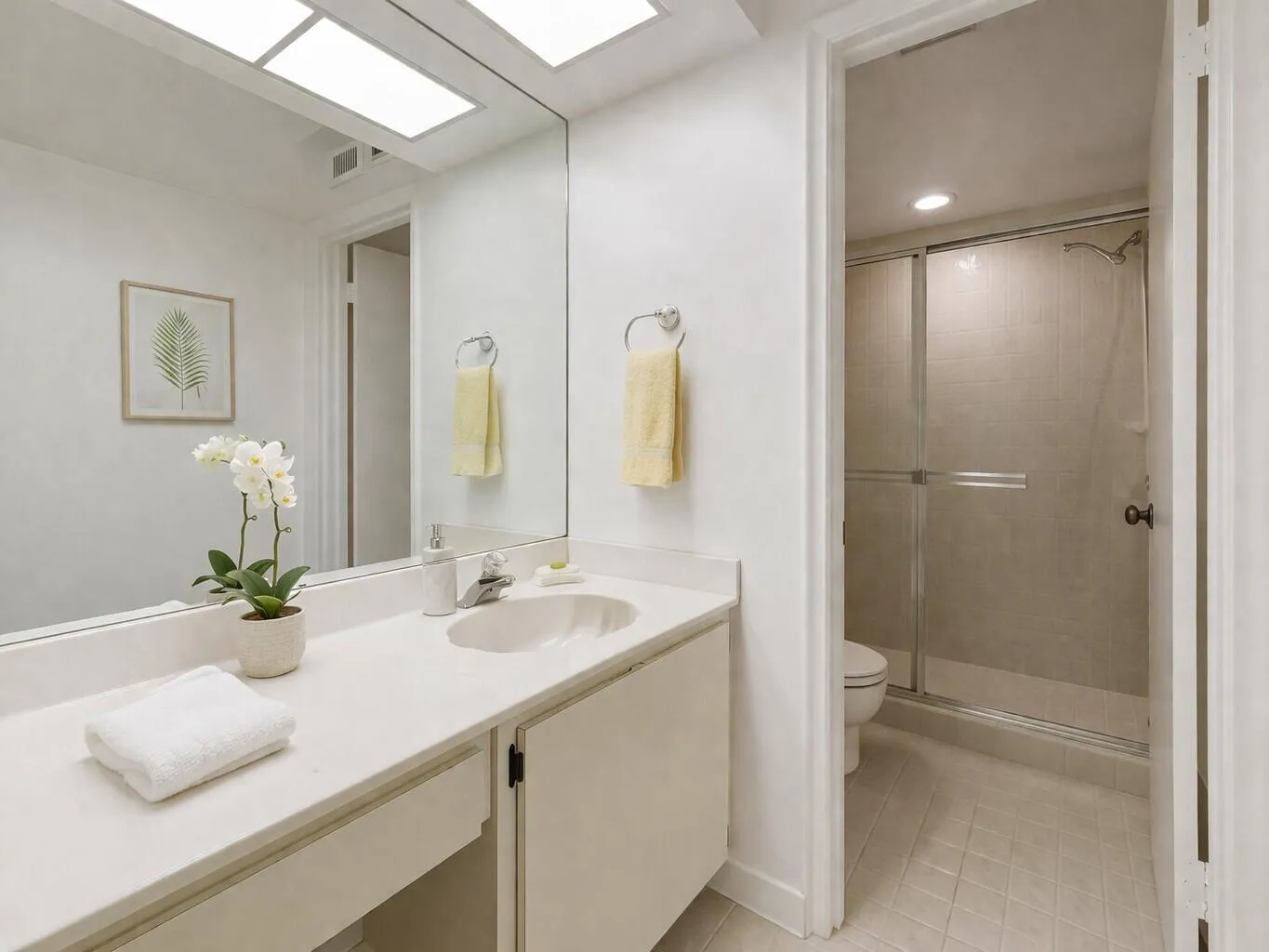 Well maintained bath with vanity & walk-in shower.