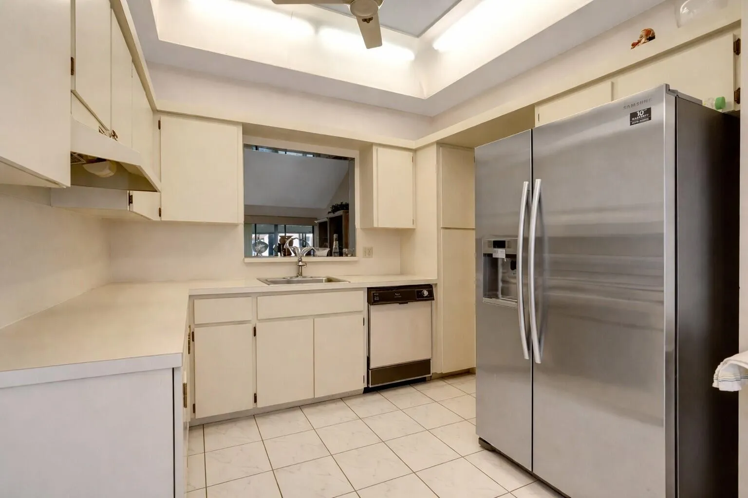 Functional layout with generous cabinetry & full size appliances.