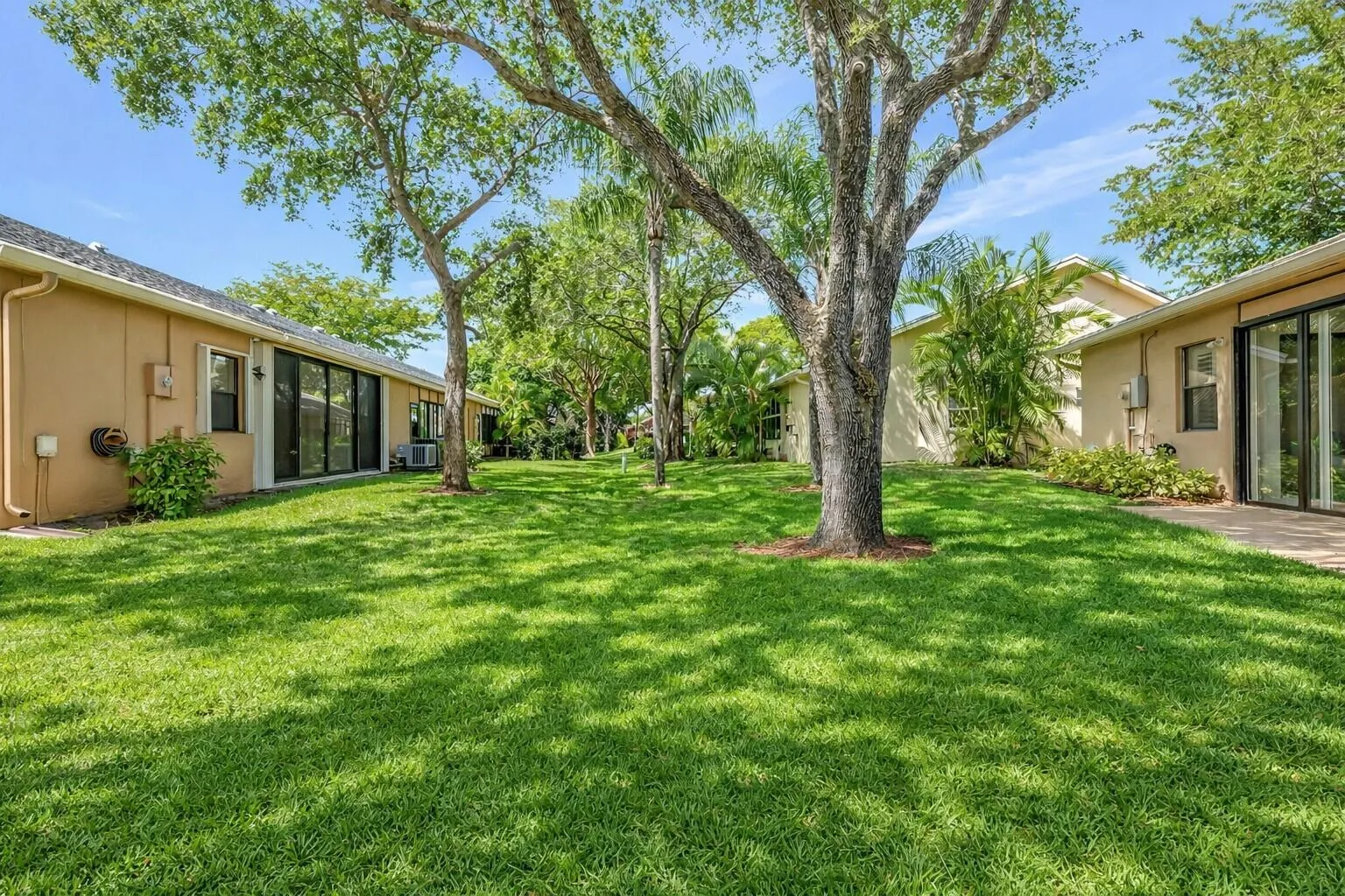 Beautiful landscaped grounds with open green space abd shade trees.