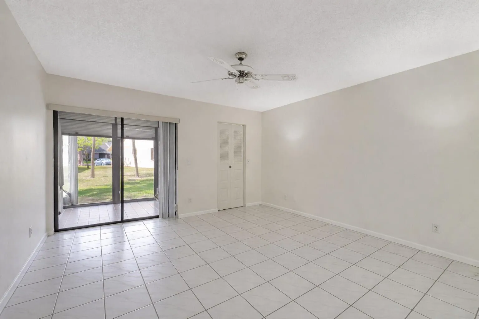 Bright room with sliding doors & natural light throughout.