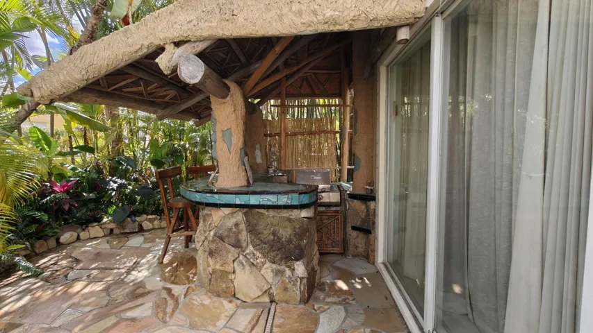 Tiki bar concrete covered roof outside primary bedroom