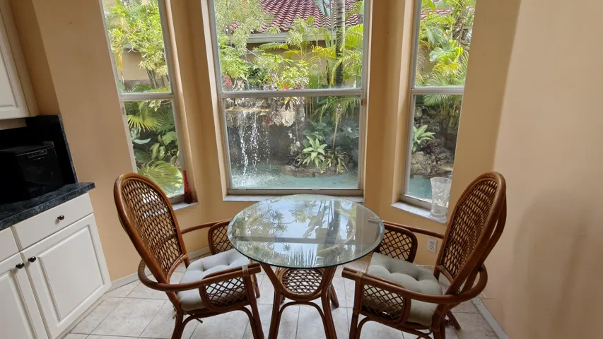 Breakfast area attached to kitchen- View of pool