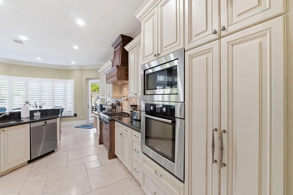 42” Cream solid maple cabinetry with accent glaze + crown molding