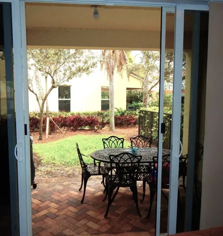 Through Sliding Glass Doors to Patio and Backyard
