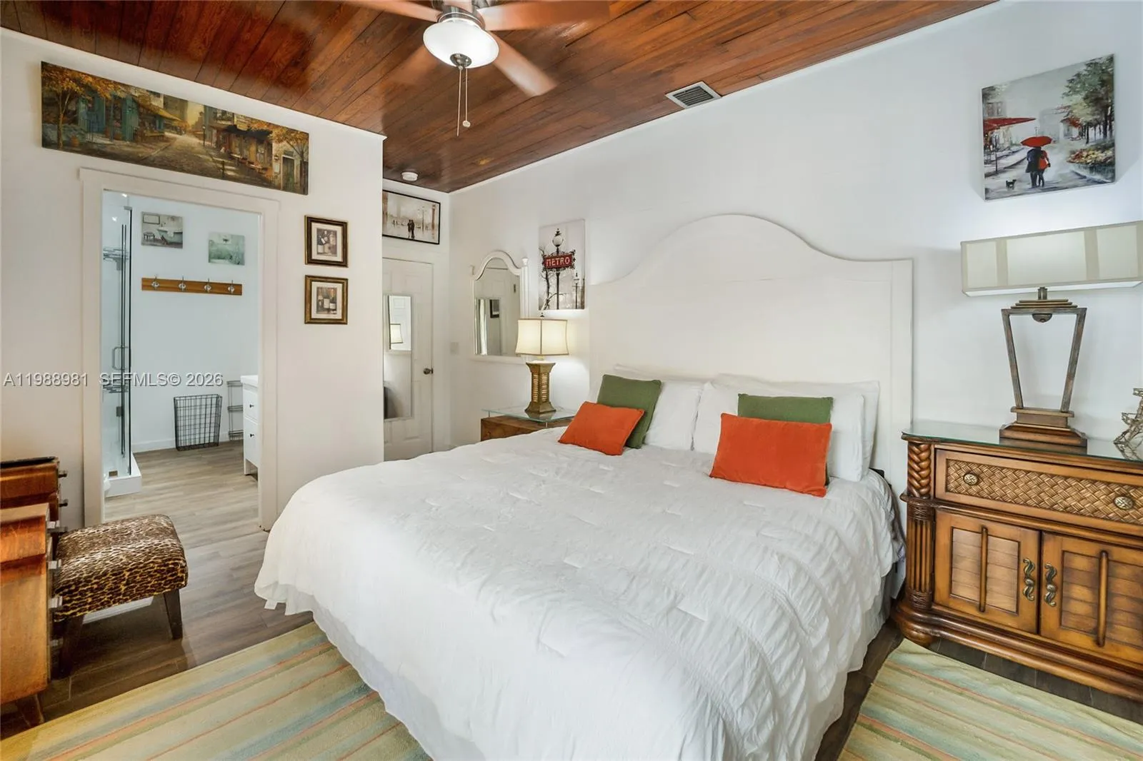 King size bed in master bedroom with direct access to the bathroom and a private covered deck.