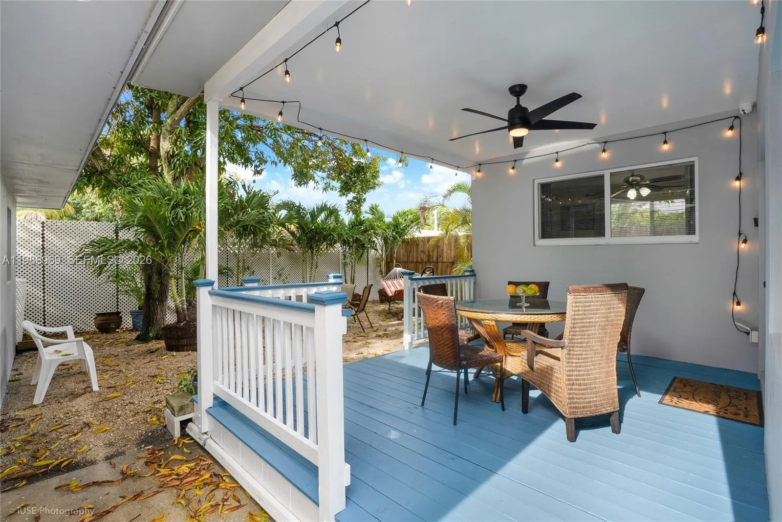 Corner Guest bedroom overlooking the backyard and private covered deck in separate wing with 2 queen size beds