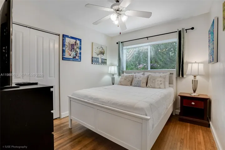 Guest bedroom with a queen size bed and a smart TV