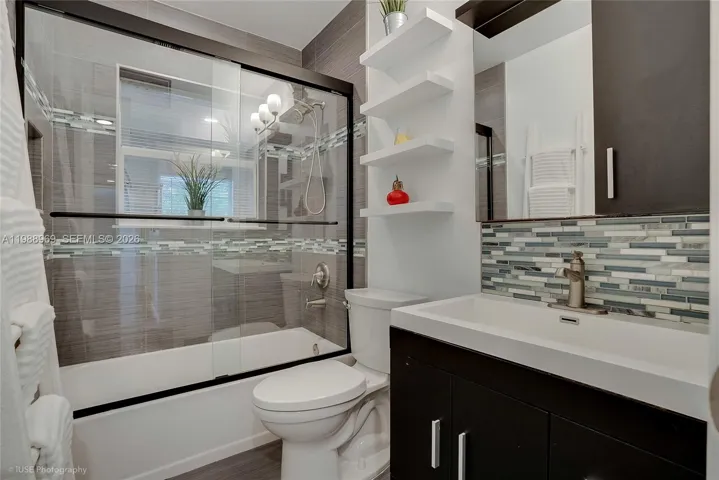 Guest bathroom has a tub