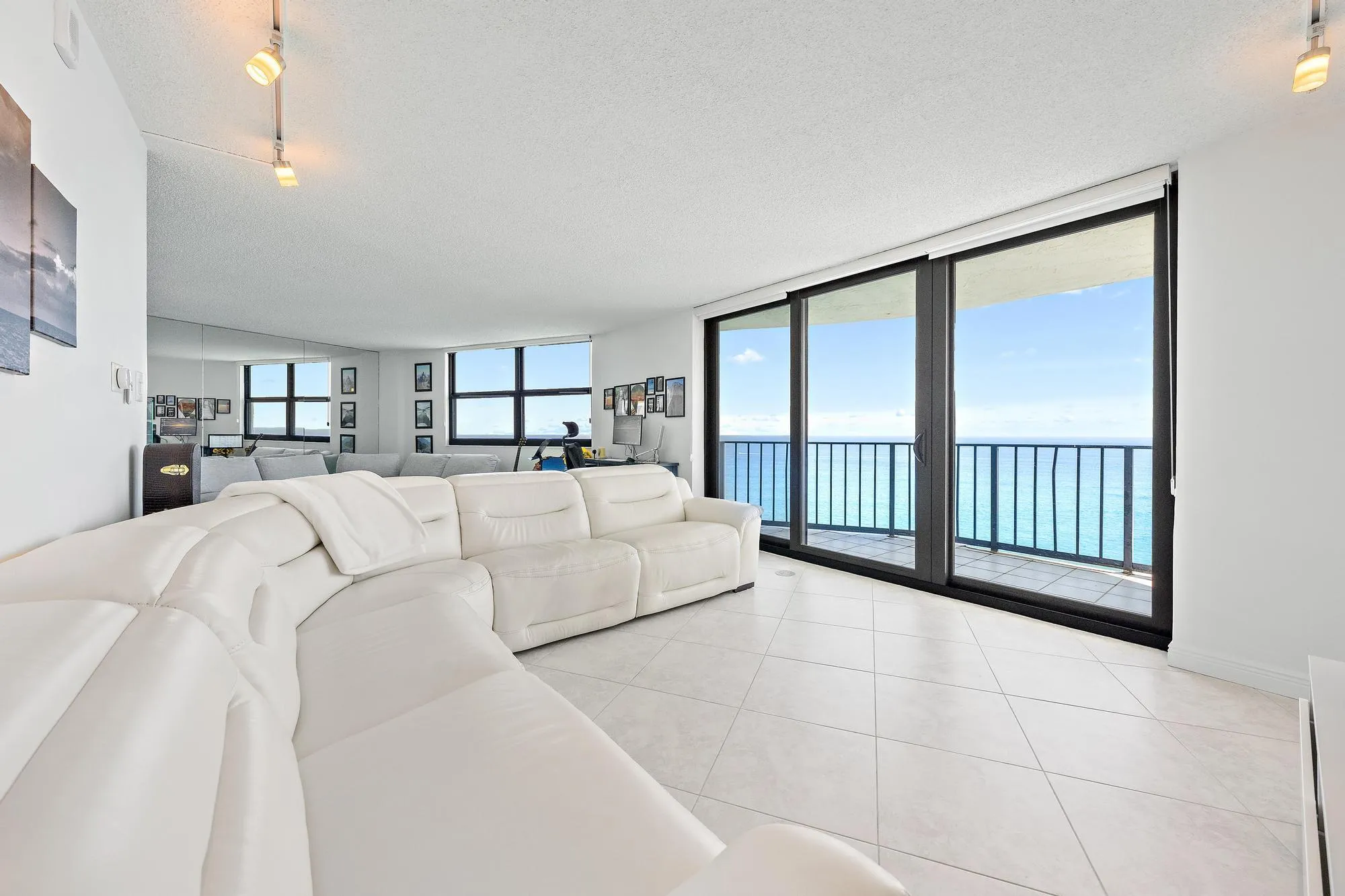 Spacious living room and easy access to your covered balcony from the impact sliders.