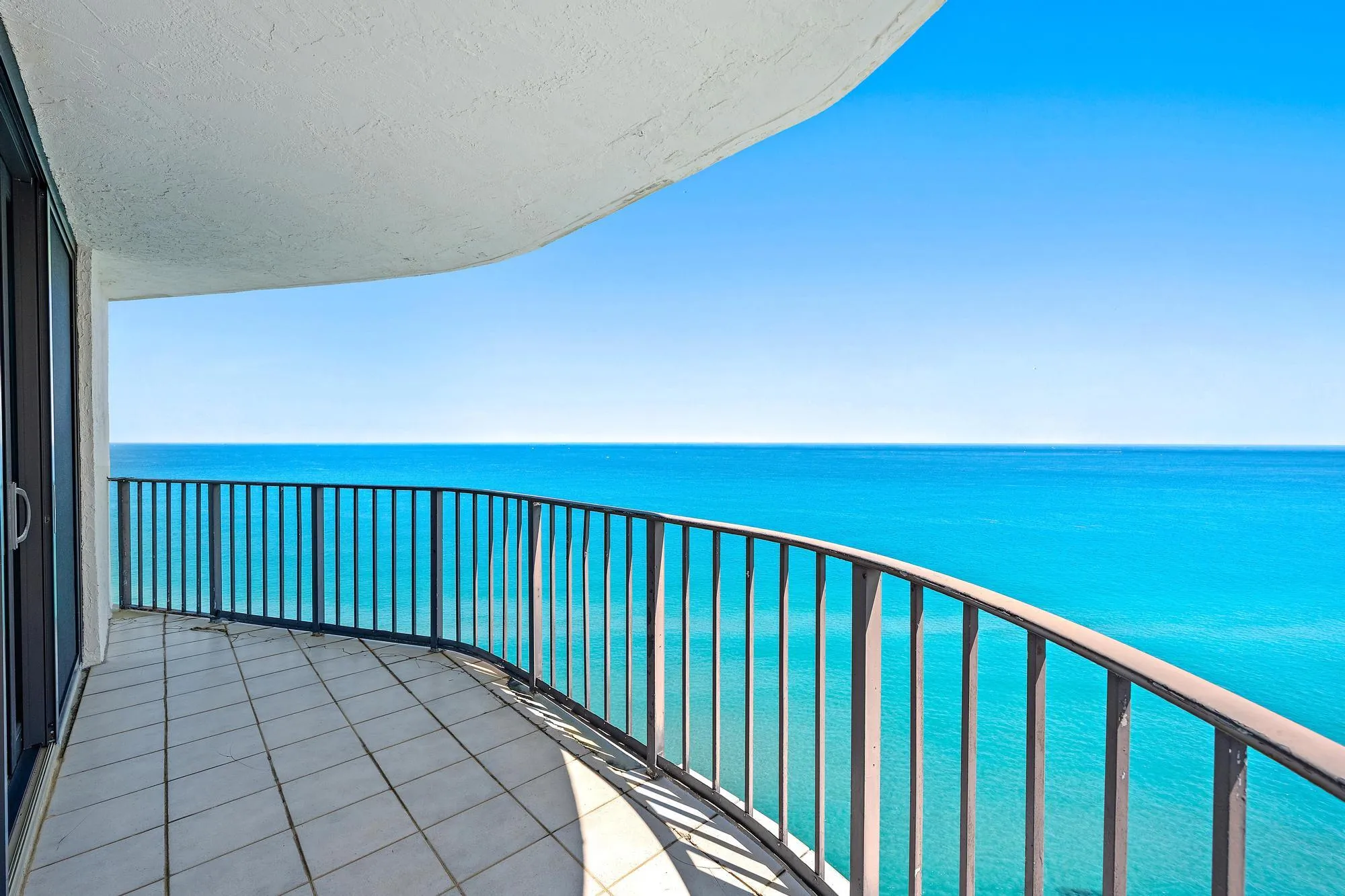 Large wrap-around balcony facing east, southeast, and south.
