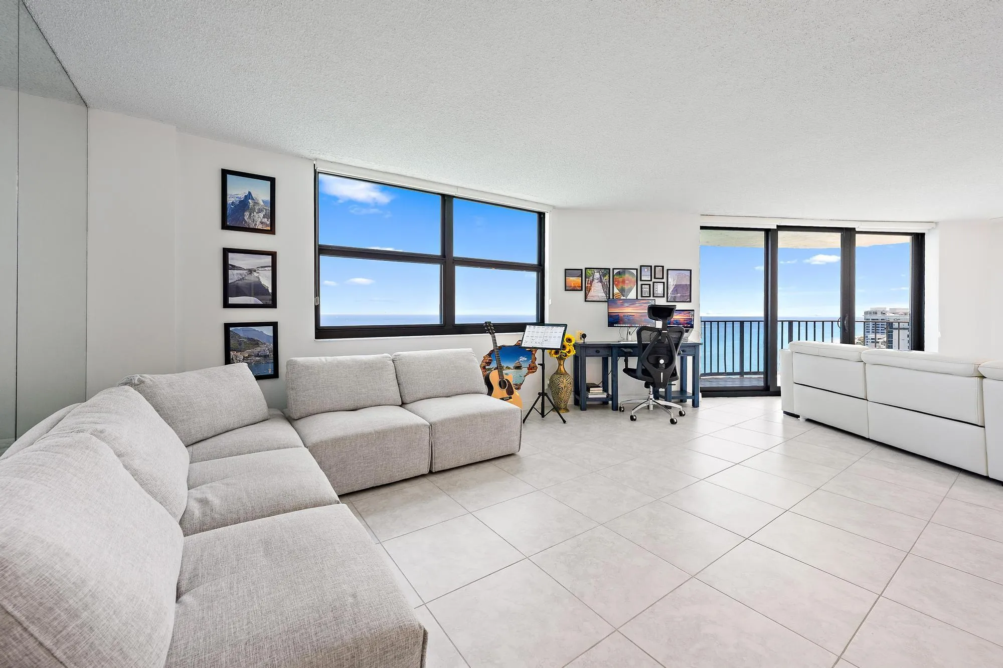 Large living room and dining room with ocean views.