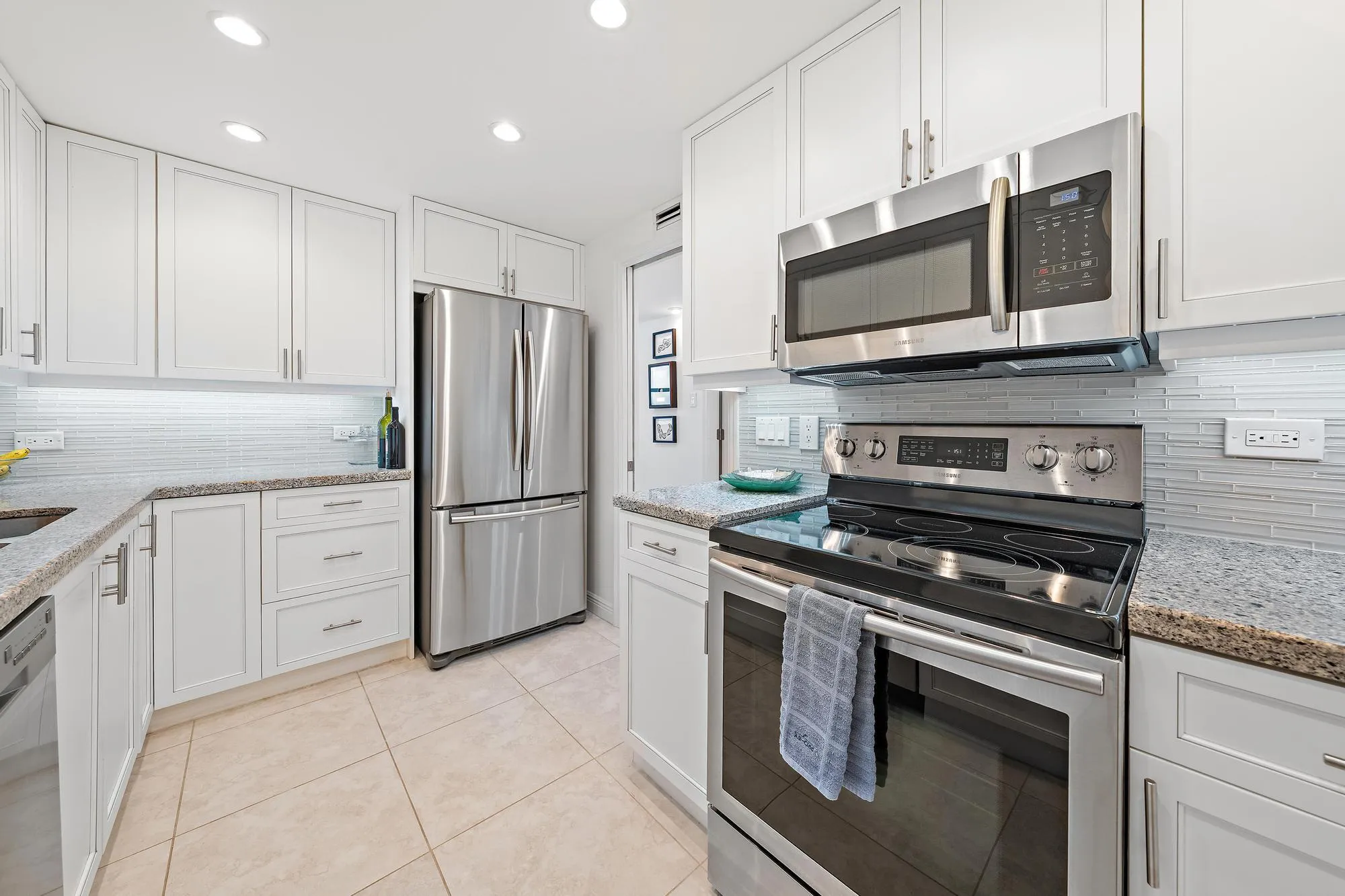 Updated kitchen with stainless steel appliances.