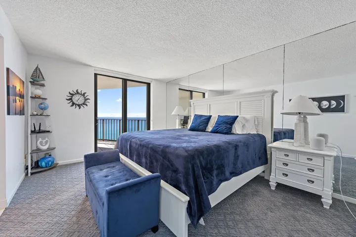 Spacious bedroom with impact sliders to your covered balcony.