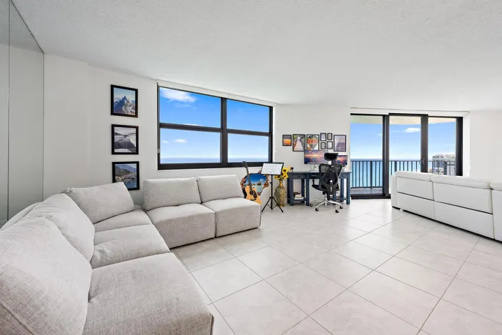 Large living room and dining room with ocean views.