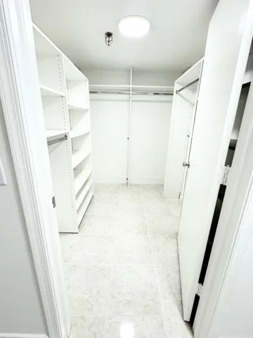 PRIMARY BEDROOM LARGE SPACIOUS WALK IN CLOSET