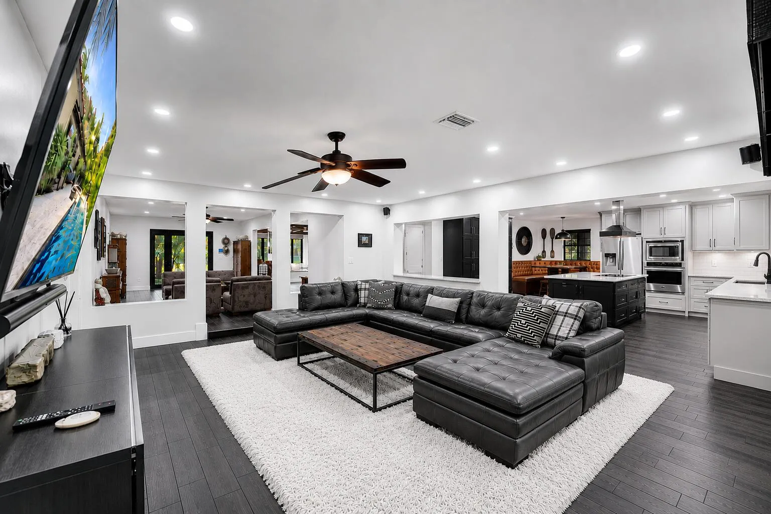 Virtually reimagined with white rug & white cabinetry in kitchen.