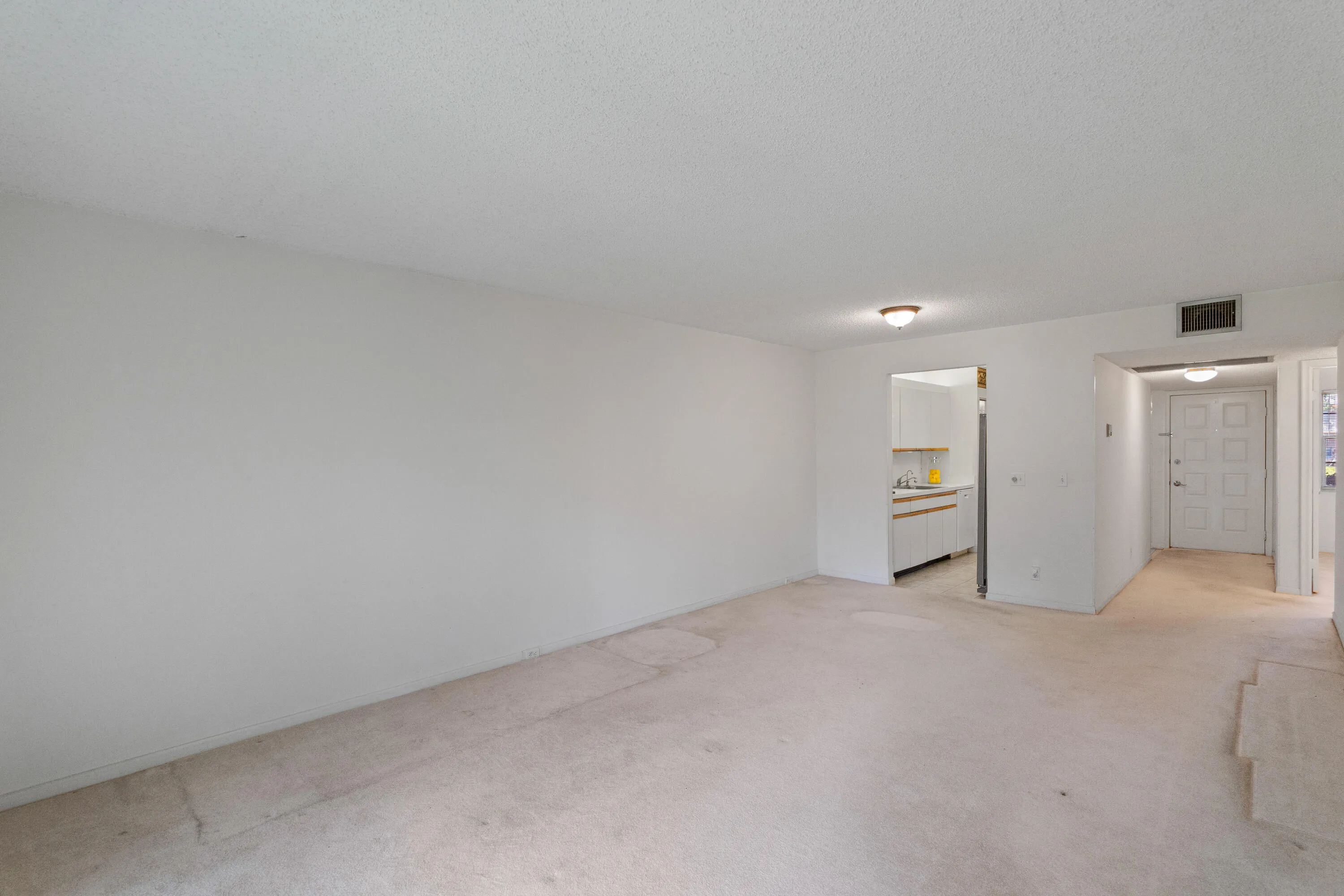Spacious living and dining area with an open layout, offering flexibility for comfortable everyday living and entertaining.